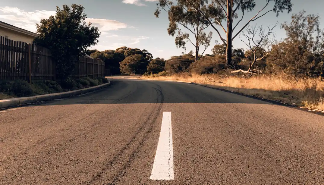 Freshly painted white line crossing an empty Australian rural road